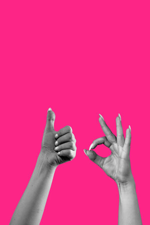 Female hands gesturing of sign nice good okay isolated on pink background.の写真素材