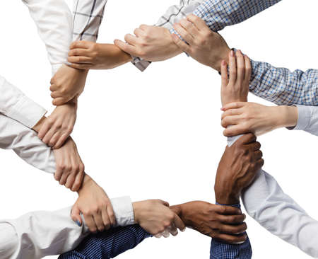 Male and female hands holding each other isolated over white background.