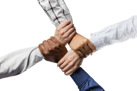 Close-up male and female hands holding each other isolated on white background.