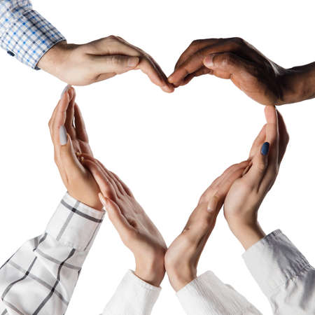 Close-up human hands making shape of heart isolated over white background