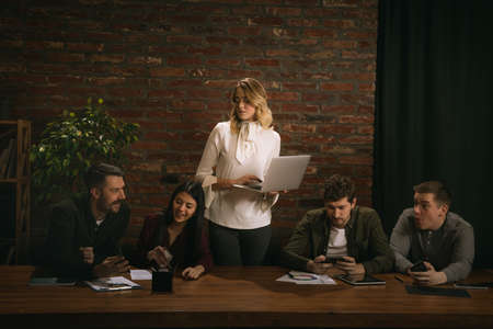 Young people at office meeting in classical painting in renaissance style.の写真素材