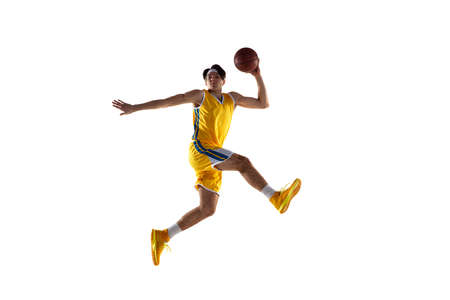 Young Caucasian basketball player training isolated on white background.