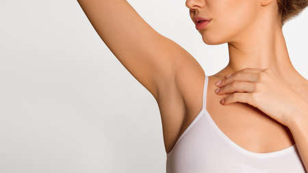 Close-up young attractive woman in underwear over white background.