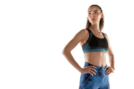 Full length portrait of sportive girl isolated over white studio background.