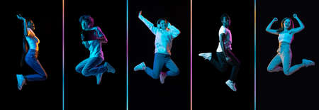 Collage of young men and women jumping isolated on dack background in neon. Flyerの写真素材