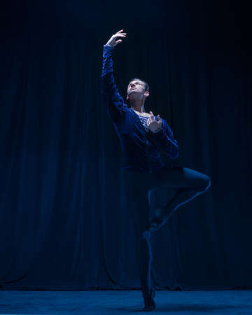 Young and graceful ballet dancer isolated on dark background in neon light. Art, action, inspiration...
