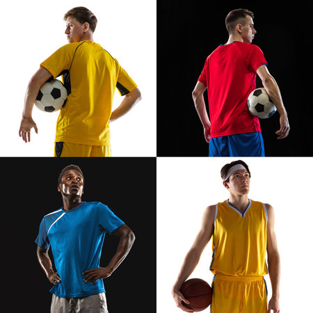 Four soccer footbal players, professional sportsmen posing isolated over black and white background.の写真素材