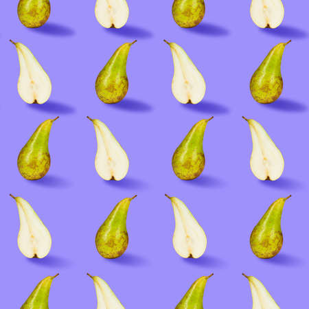 Contemporary art collage. Halves and whole green juicy pears arranged over bright purple background.の写真素材