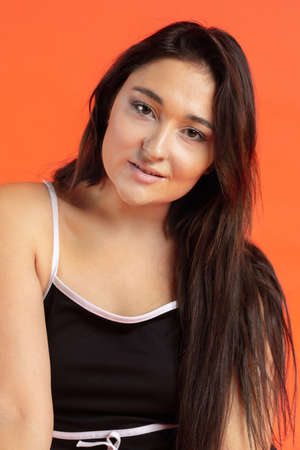Happy positive plus size woman. Face close up. Pretty caucasian female model at studio. Concept of...