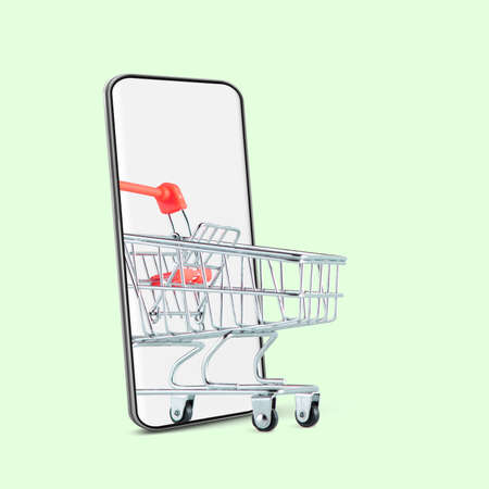 Creative collage. Supermarket trolley rolling out of the smartphone screen over light green background.の写真素材