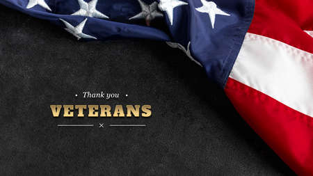 Top view Flag of the United States of America on black textured background. Memorial Day and Veterans Day concept.の写真素材