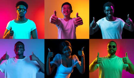 Six young people, happy, positive men and women isolated over colored backgrounds in neon lights.の写真素材
