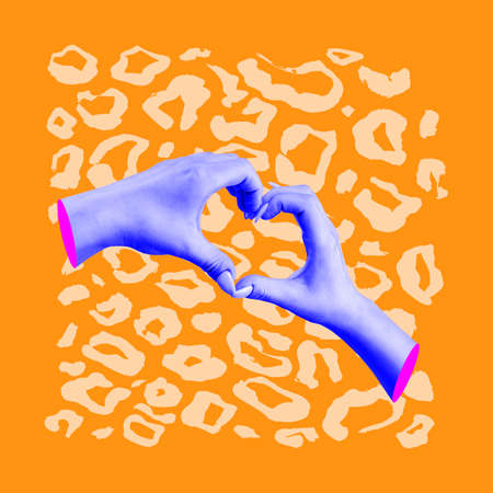 Contemporary art collage. Human hands islated over orange backgroundの写真素材