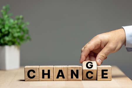 Wooden cubes with letters on the table transform wording change to chance. Copyspace for ad.の写真素材