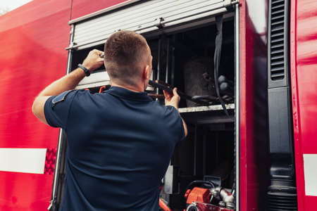 Firefighter with special instruments for ambulance firefightingの写真素材