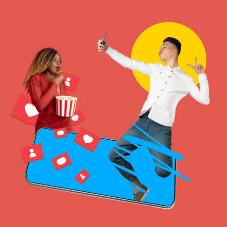 Social media influencer making showing up from lapton on yellow backgroundの写真素材