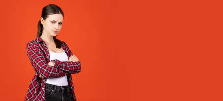 Portrait of young caucasian girl showing iritation isolated on orange backgroundの写真素材