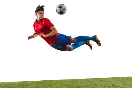 Young Caucasian soccer football player training isolated on white background. In a fly