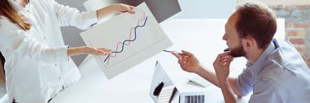 Motivated business team of two employee working together in office. Teamwork banner. Concept of...