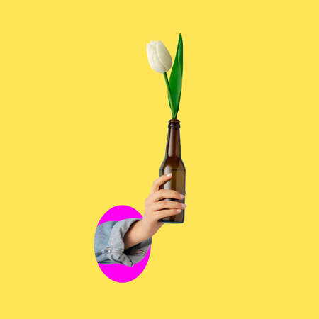 Contemporary art collage of female hand holding beer bottle with tulip flower inside isolated over...