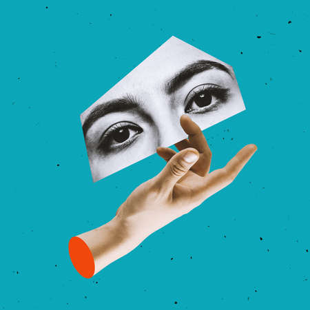Contemporary art collage of human hand and piece of black and whie part of female face, eyes isolated over blue backgroundの写真素材