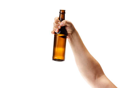 Cropped image of male hand holding bottle of lager beer isolated over white backgroundの写真素材