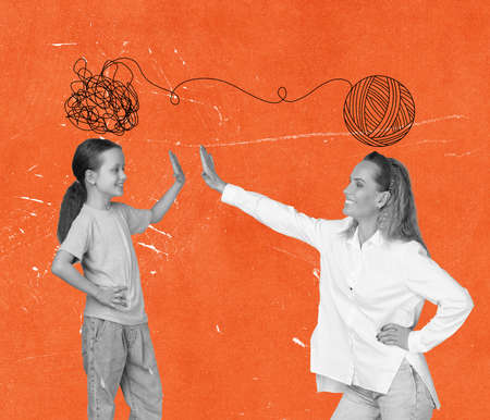 Contemporary art collage of mother and daughter giving high five isolated over orange backgroundの写真素材