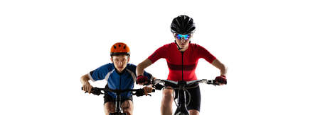 Collage of woman and boy, cyclists, riding a bike in helmet isolated over white backgroundの写真素材
