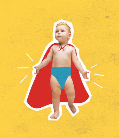 Contemporary art collage of little boy, playful child wearing red cloak like isolated over yellow backgroundの写真素材