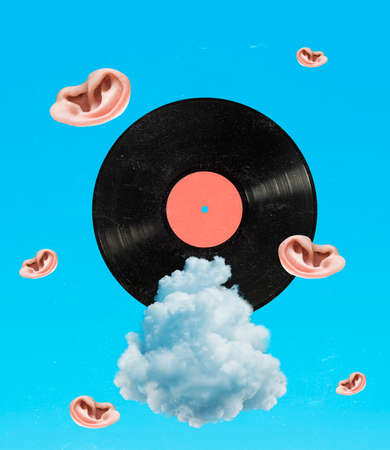 Contemporary art collage of vinyl record and human ears flying ruound isolated over blue backgroundの写真素材