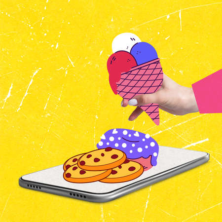 Contemporary art collage of hand holding ice cream, donut and cookies lying on phone screen isolated over yellow backgroundの写真素材