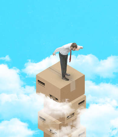 Contemporary art collage of man standing on delivery box and looking down from the sky isolated over cloudy sky backgroundの写真素材