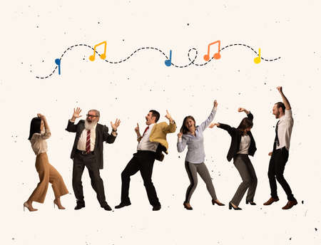 Creative image of colleagues dancing, having fun on corporate eveningの写真素材