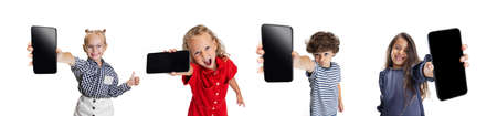 Collage of beautiful smiling children showing phone screen isolated over white backgroundの写真素材