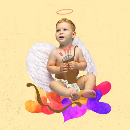 Creative art design. Little boy, toddler in diaper with love cupid arrows and hearts isolated over yellow backgroundの写真素材