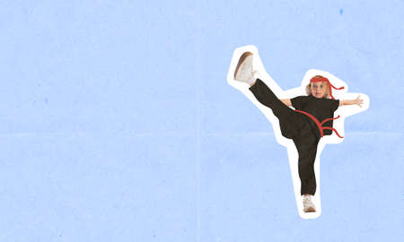 Contemporary art collage of little girl, martial art fighter, karate athlete isolated over purple backgroundの写真素材