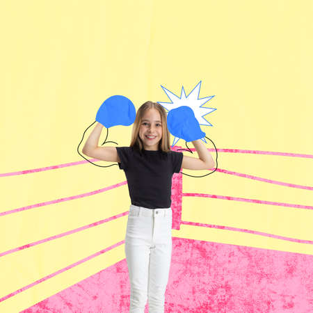 Contemporary art collage with girl, child pretending to be boxer on ring isolated over yellow backgroundの写真素材