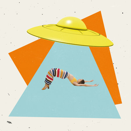 Creative design. Young stylish woman lying under UFO isolated over colorful background with geometric figuresの写真素材