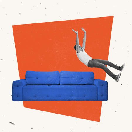 Creative design. Young man falling down on long blue sofa after hard dayの写真素材