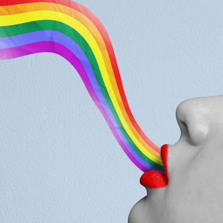 Conceptual image. Rainbow appearing from female lips symbolizing support of human rightsの写真素材