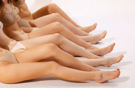 Image of slender female legs isolated over grey studio background. Smooth skin. Depilation, epilation body care. Concept of beauty, body and skin care, health, spa, cosmetics, cosmetology, adの写真素材