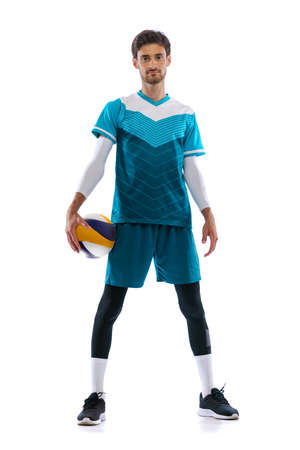 Portrait of young man, volleyball player posing in uniform isolated over white studio background. Motivation. Concept of sport, action, team game, active lifestyle, health, hobby, adの写真素材