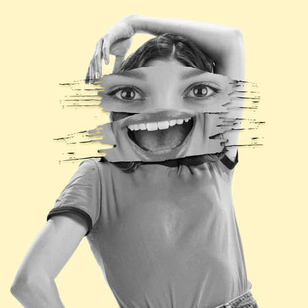 Contemporary art collage. Emotive young woman with cheerful face elements posing isolated on yellow background. Concept of surrealism, creativity, imagination, emotions, lifestyle, adの写真素材