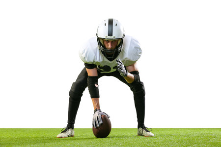 Portrait of concentrated man, american football player starting game, posing isolated over white background. Concept of active life, team game, energy, sport, competition. Copy space for adの写真素材