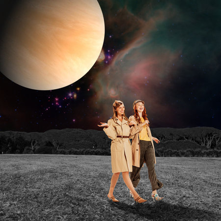 Contemporary art collage. Stylish, beautiful, young women cheerfully talking, walking on field over space and planet background. Concept of surreal design, creativity, freedom, relationship, natureの写真素材
