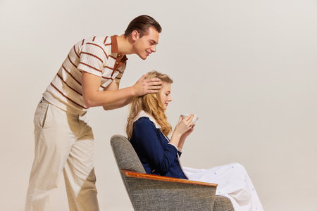 Love and care. Young, beautiful, stylish couple in love wearing vintage style fashion clothes...