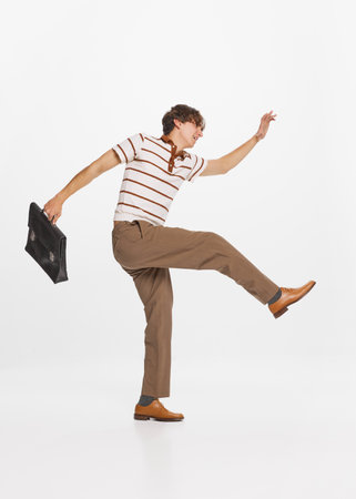 Businessman, trader. Happy young handsome man in retro style fashion outfit over grey background....