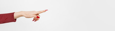 Human hand pointing at right direction isolated over white background. Banner with copy space for...