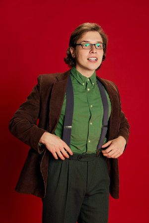 New employee. Studio footage young man, student or office clerk in vintage fashion style costume,...