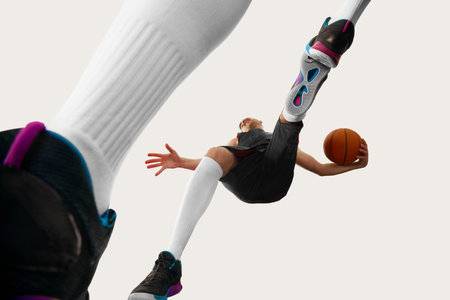 A fisheye view image of professional basketball player jumping over with ball over white background....